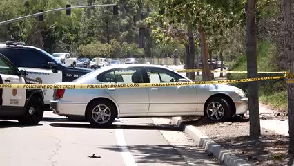 Mujer es detenida tras persecución en vehículo robado; oficial dispara durante el incidente en San Diego